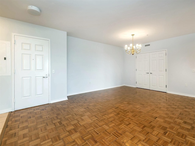 100 Harbor View Dr Unit 515, Port Washington, NY 11050 - unfurnished room featuring a chandelier, baseboards, and a smoke detector