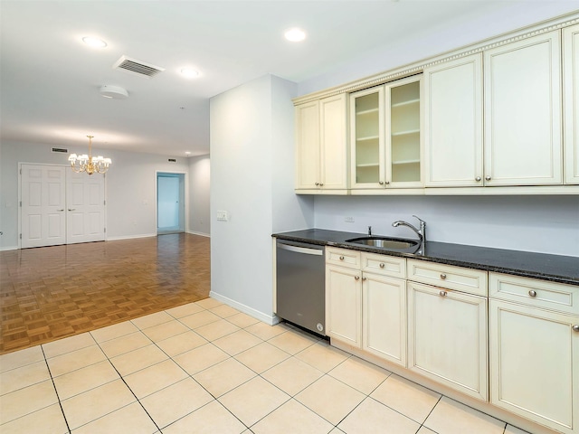 100 Harbor View Dr Unit 515, Port Washington, NY 11050 - kitchen with stainless steel dishwasher, a sink, a chandelier, baseboards, and cream cabinetry