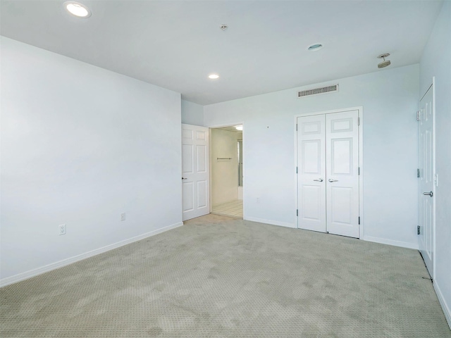 100 Harbor View Dr Unit 515, Port Washington, NY 11050 - unfurnished bedroom with carpet, baseboards, a closet, and recessed lighting