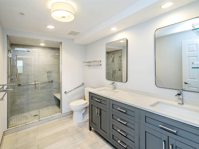 100 Harbor View Dr Unit 515, Port Washington, NY 11050 - full bath with toilet, a stall shower, double vanity, recessed lighting, and wood finished floors