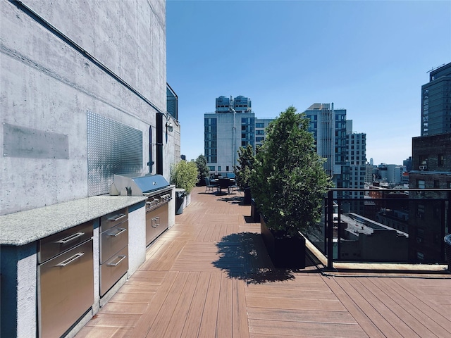 148 E 24th St Unit 5B, New York Manhattan, NY 10010 - wooden terrace with a view of city, a grill, and exterior kitchen