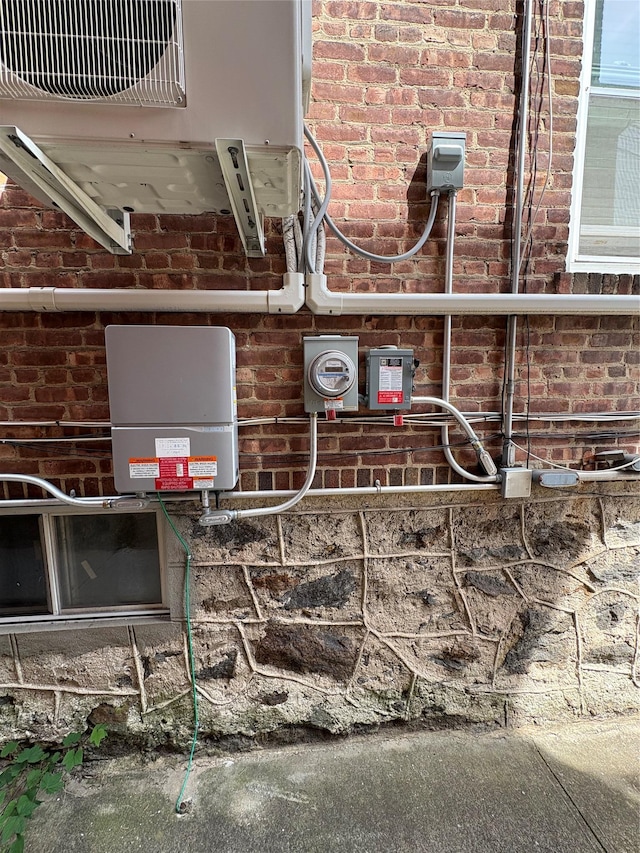 4279 Oneida Ave, Bronx, NY 10470 - exterior view of brick siding, electric meter, and ac unit