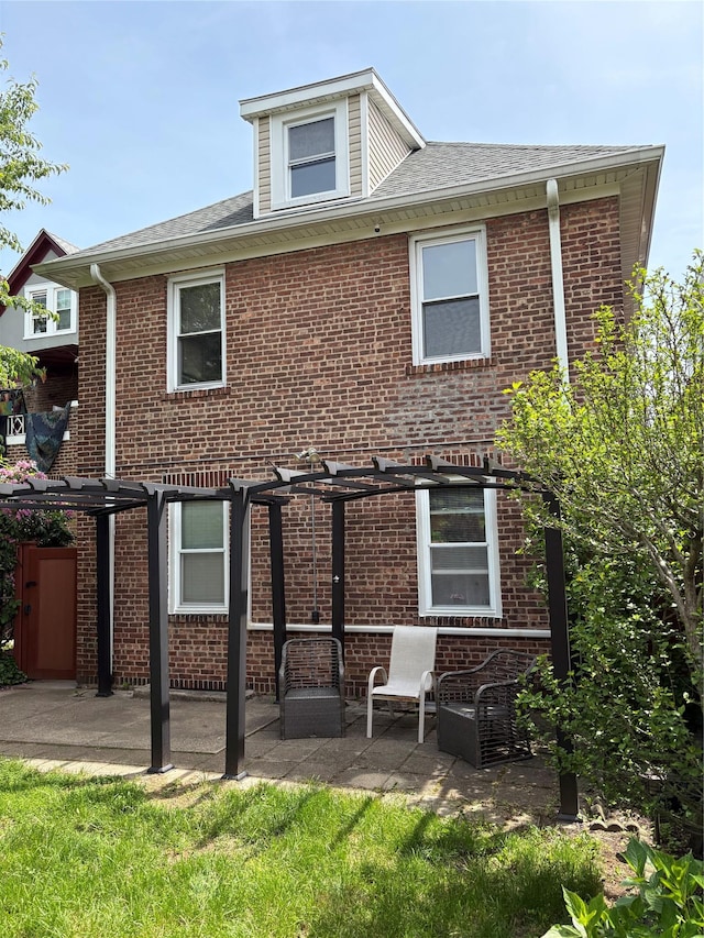4279 Oneida Ave, Bronx, NY 10470 - rear view of property with a pergola, a patio, and brick siding