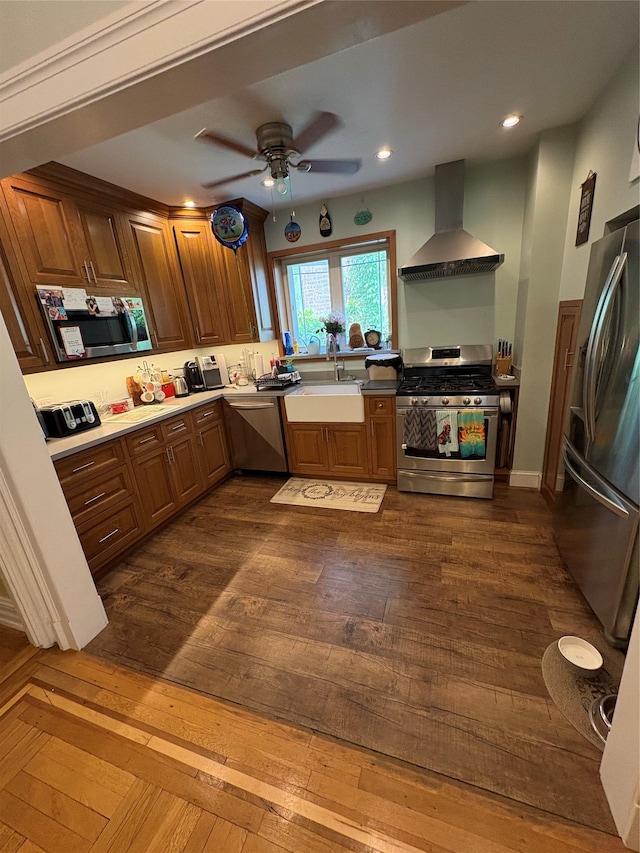 4279 Oneida Ave, Bronx, NY 10470 - kitchen with stainless steel appliances, wall chimney range hood, a sink, ceiling fan, and dark wood-style floors