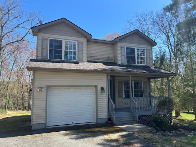 11 Willow Ln, Glen Spey, NY 12737 - view of front of home with an attached garage and covered porch