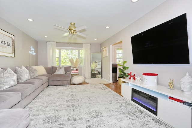 100 Dowd St Unit C12, Haverstraw, NY 10927 - living room featuring healthy amount of natural light, recessed lighting, a ceiling fan, wood finished floors, and a glass covered fireplace