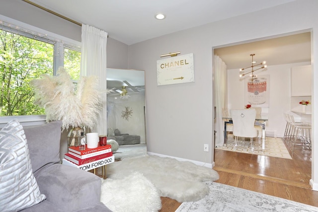 100 Dowd St Unit C12, Haverstraw, NY 10927 - living area with wood finished floors, baseboards, recessed lighting, and ceiling fan