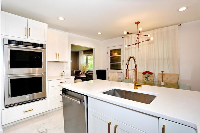 100 Dowd St Unit C12, Haverstraw, NY 10927 - kitchen with stainless steel appliances, a sink, light marble finish flooring, light countertops, and recessed lighting