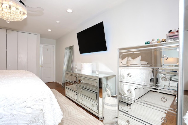 100 Dowd St Unit C12, Haverstraw, NY 10927 - bedroom featuring a chandelier, recessed lighting, wood finished floors, a closet, and baseboards