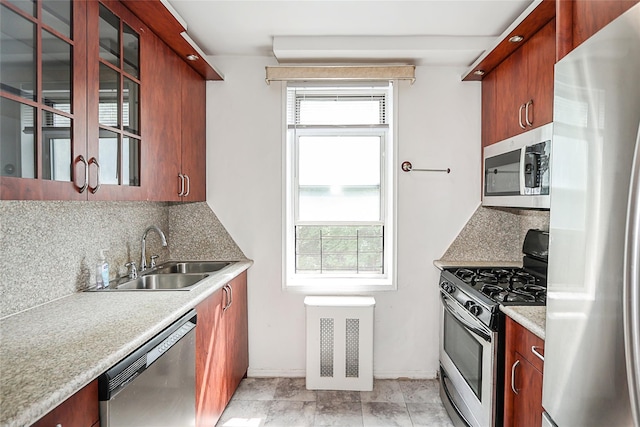 7445 Yellowstone Blvd Unit 5C, Rego Park, NY 11374 - kitchen with stainless steel appliances, a sink, decorative backsplash, and glass insert cabinets