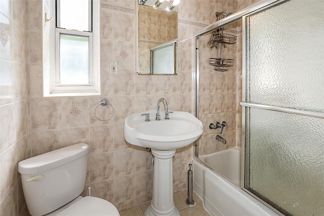 7445 Yellowstone Blvd Unit 5C, Rego Park, NY 11374 - full bath with toilet, tile walls, and bath / shower combo with glass door