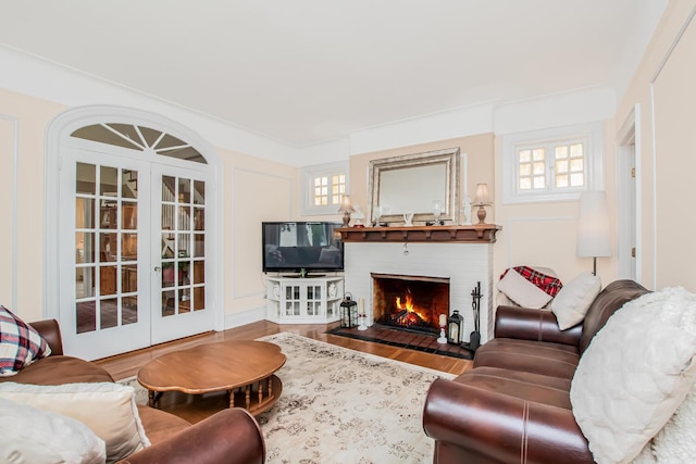 37 Lee Ave, Yonkers, NY 10705 - living room with french doors, a fireplace, plenty of natural light, and wood finished floors