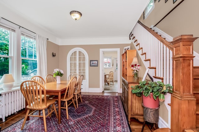 37 Lee Ave, Yonkers, NY 10705 - dining space with stairs, radiator, and wood finished floors