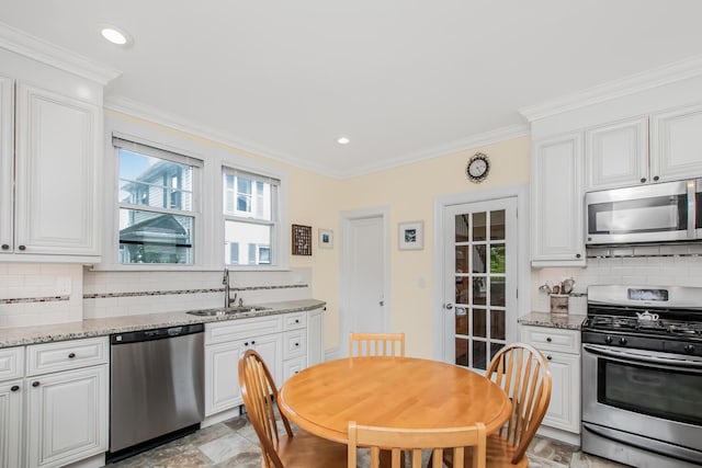 37 Lee Ave, Yonkers, NY 10705 - kitchen with stainless steel appliances, a sink, tasteful backsplash, plenty of natural light, and ornamental molding