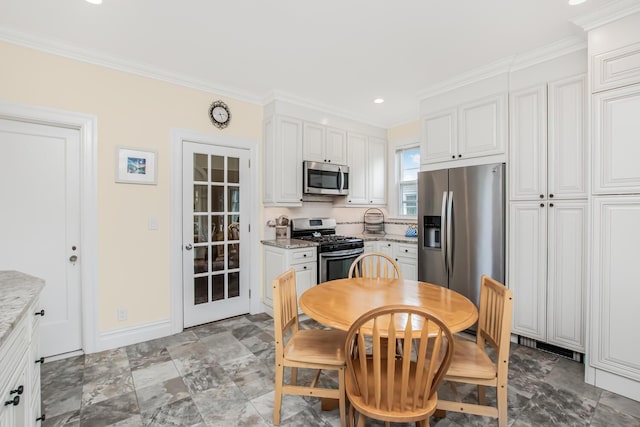 37 Lee Ave, Yonkers, NY 10705 - kitchen featuring stainless steel appliances, ornamental molding, white cabinets, tasteful backsplash, and recessed lighting