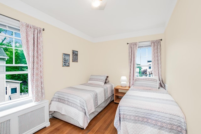 37 Lee Ave, Yonkers, NY 10705 - bedroom featuring radiator, multiple windows, and wood finished floors