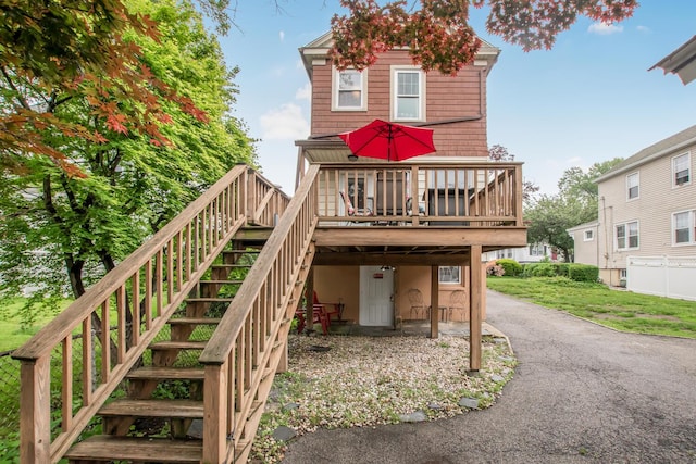 37 Lee Ave, Yonkers, NY 10705 - back of house with stairway, a deck, and asphalt driveway