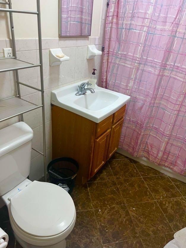 79 Hamilton Pl Unit 5, New York Manhattan, NY 10031 - full bath with tile walls, vanity, and toilet