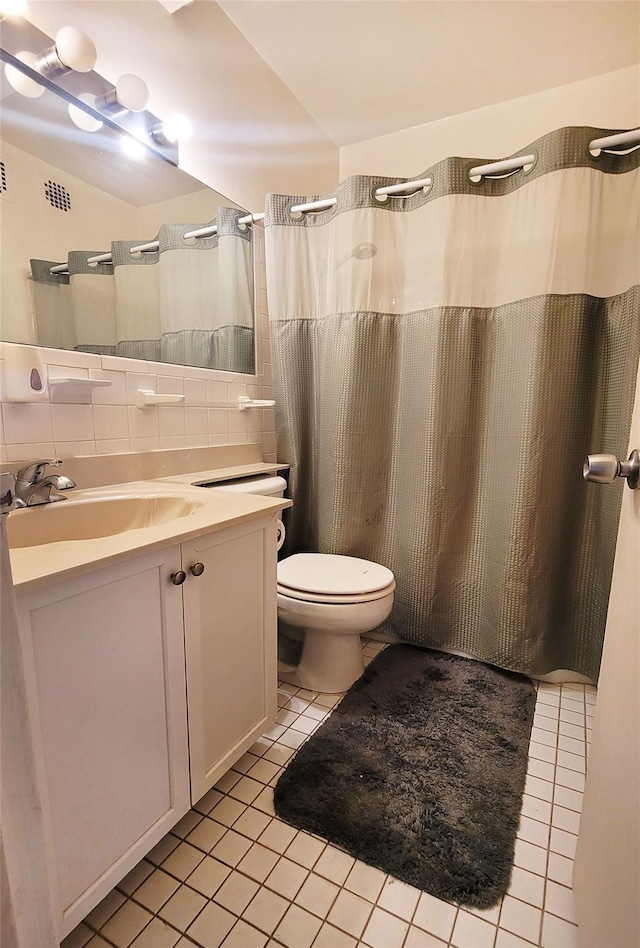 99-72 66rd Unit 7Aa, Rego Park, NY 11374 - bathroom featuring tile patterned flooring, vanity, toilet, tile walls, and a shower with shower curtain