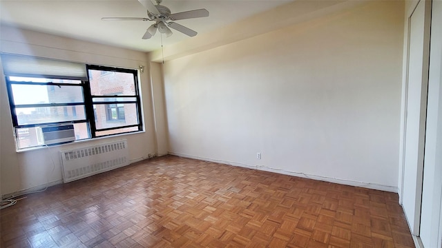99-72 66rd Unit 7Aa, Rego Park, NY 11374 - spare room with radiator heating unit, ceiling fan, baseboards, and cooling unit