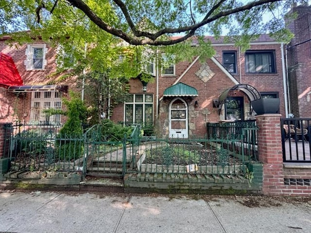 172-18 111th Ave, Jamaica, NY 11433 - view of front of property with a fenced front yard and brick siding