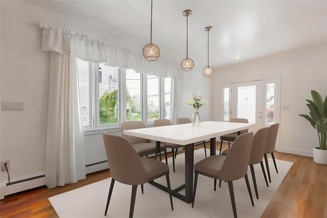 849 E Bay Dr, West Islip, NY 11795 - dining room featuring light wood finished floors, a baseboard radiator, and baseboards
