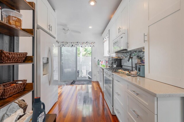 849 E Bay Dr, West Islip, NY 11795 - kitchen featuring white appliances, ceiling fan, white cabinets, recessed lighting, and wood finished floors