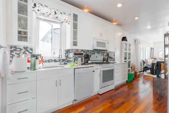 849 E Bay Dr, West Islip, NY 11795 - kitchen featuring white appliances, light countertops, white cabinetry, a sink, and recessed lighting