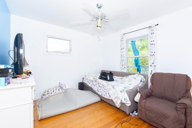 849 E Bay Dr, West Islip, NY 11795 - bedroom with light wood-style flooring and a ceiling fan