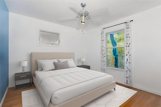 849 E Bay Dr, West Islip, NY 11795 - bedroom with light wood-type flooring, baseboards, and ceiling fan