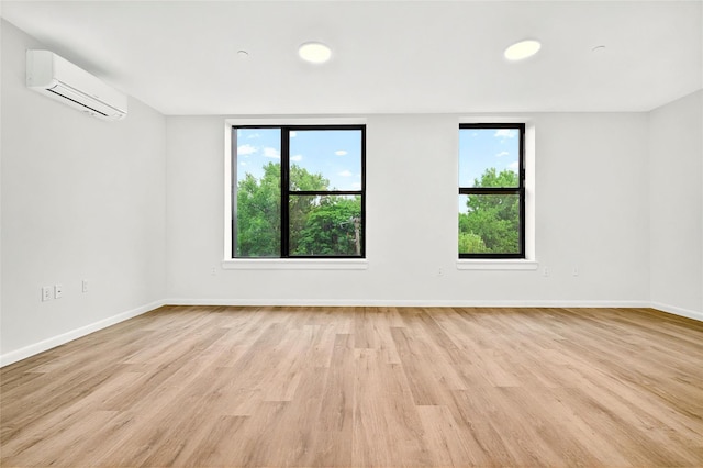 1727 Lacombe Ave Unit 2B, Bronx, NY 10473 - spare room with a wall mounted AC, healthy amount of natural light, and light wood finished floors