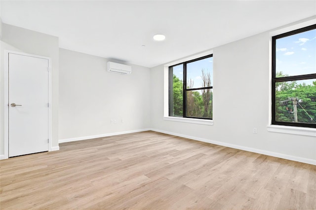 1727 Lacombe Ave Unit 2B, Bronx, NY 10473 - unfurnished room with a wall mounted AC and light wood finished floors
