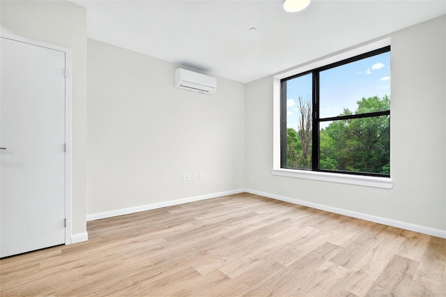 1727 Lacombe Ave Unit 2B, Bronx, NY 10473 - empty room featuring a wall mounted air conditioner and light wood finished floors