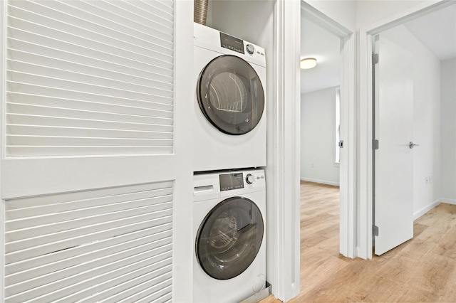 1727 Lacombe Ave Unit 2B, Bronx, NY 10473 - washroom featuring stacked washer / dryer and light wood-style floors