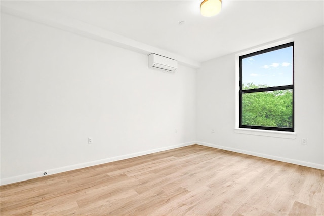 1727 Lacombe Ave Unit 2B, Bronx, NY 10473 - spare room featuring a wall mounted AC and light wood-style flooring