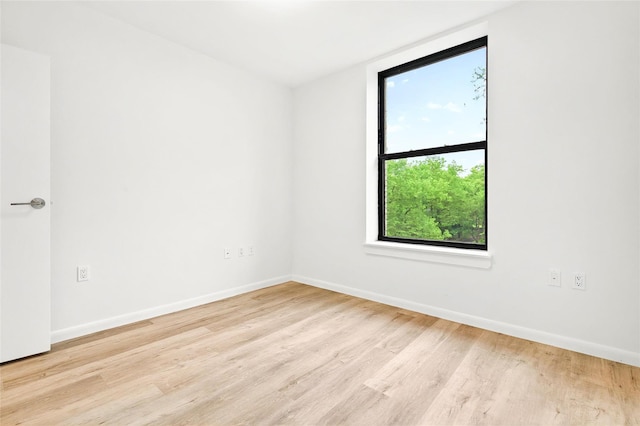 1727 Lacombe Ave Unit 2B, Bronx, NY 10473 - empty room with wood finished floors and baseboards