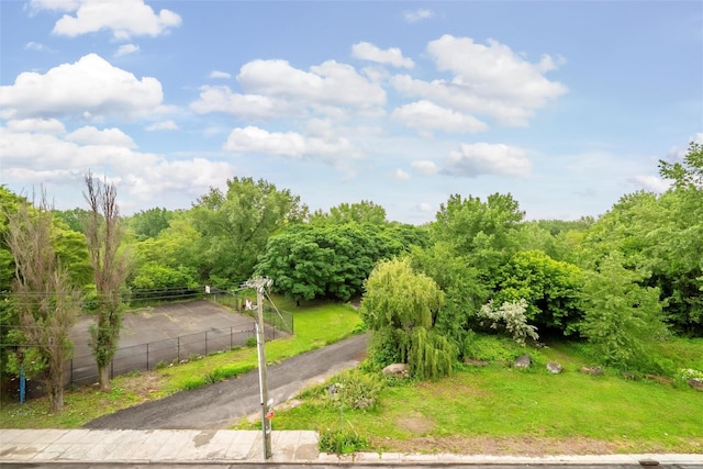 1727 Lacombe Ave Unit 2B, Bronx, NY 10473 - view of asphalt road featuring a wooded view