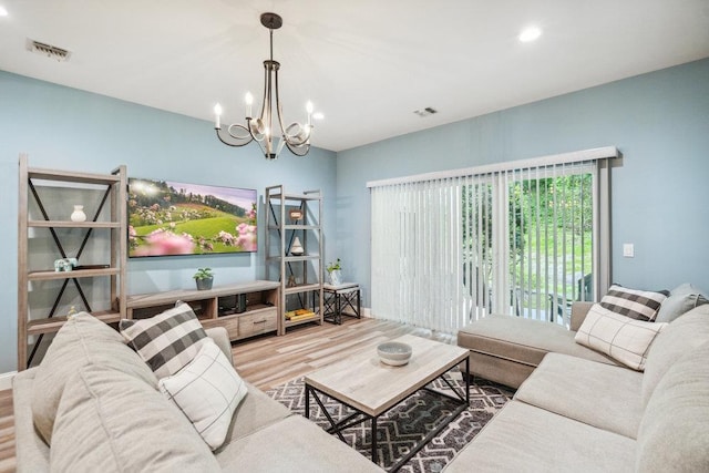 76 Sagamore Dr, Plainview, NY 11803 - living room featuring wood finished floors, a chandelier, and recessed lighting