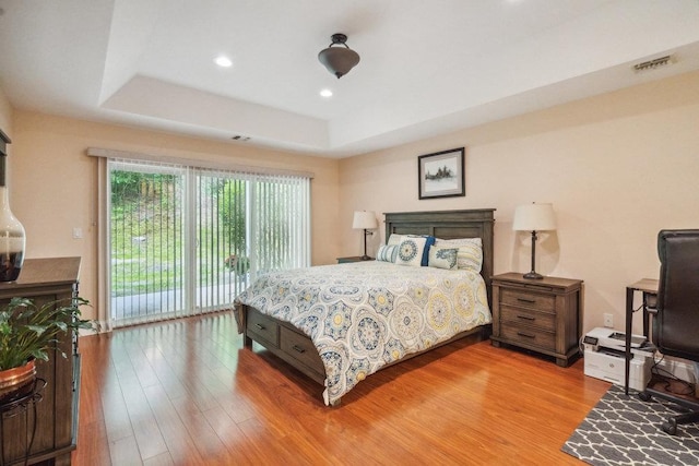 76 Sagamore Dr, Plainview, NY 11803 - bedroom featuring light wood-type flooring, a raised ceiling, access to outside, and recessed lighting