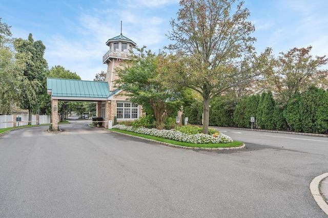 76 Sagamore Dr, Plainview, NY 11803 - view of building exterior with driveway and an attached carport