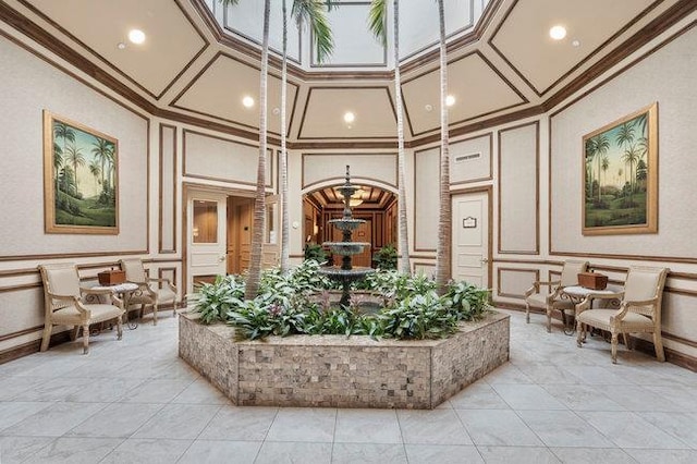 76 Sagamore Dr, Plainview, NY 11803 - community lobby featuring a decorative wall, a high ceiling, and crown molding