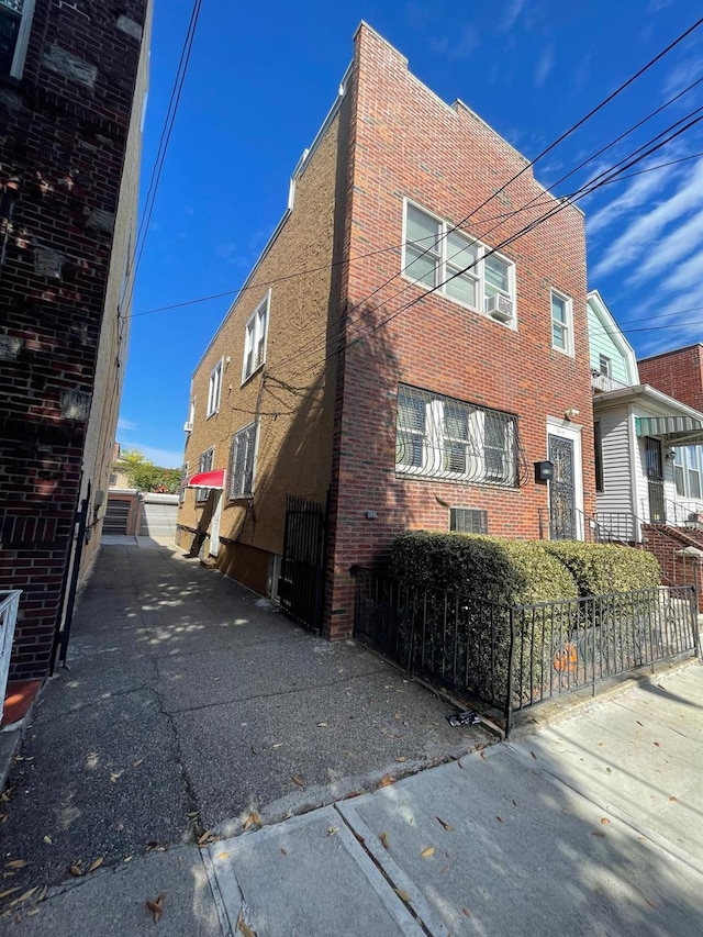 108-41 51st Ave, Corona, NY 11368 - view of side of home with brick siding