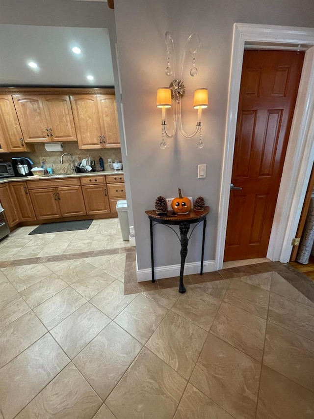 108-41 51st Ave, Corona, NY 11368 - kitchen with baseboards, light countertops, decorative backsplash, recessed lighting, and light tile patterned flooring