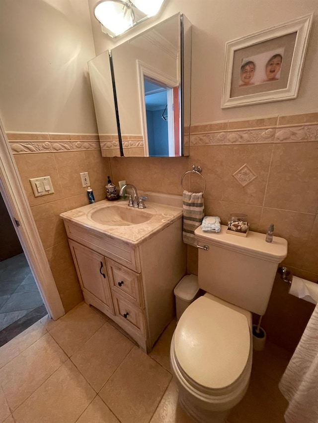 108-41 51st Ave, Corona, NY 11368 - half bath featuring tile walls, wainscoting, vanity, and toilet