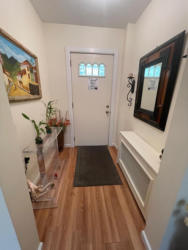 108-41 51st Ave, Corona, NY 11368 - doorway to outside featuring wood finished floors and baseboards