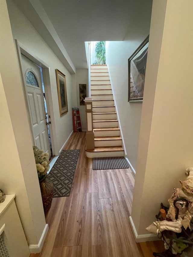 108-41 51st Ave, Corona, NY 11368 - entrance foyer featuring wood finished floors, stairs, and baseboards