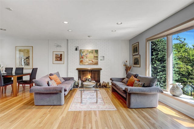 1 Exeter Pl, Glen Head, NY 11545 - living area with plenty of natural light, light wood-style flooring, a fireplace, and recessed lighting