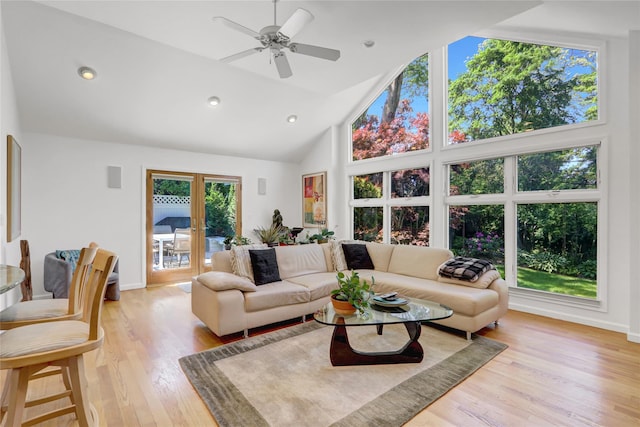 1 Exeter Pl, Glen Head, NY 11545 - living area featuring french doors, high vaulted ceiling, light wood-style floors, ceiling fan, and baseboards