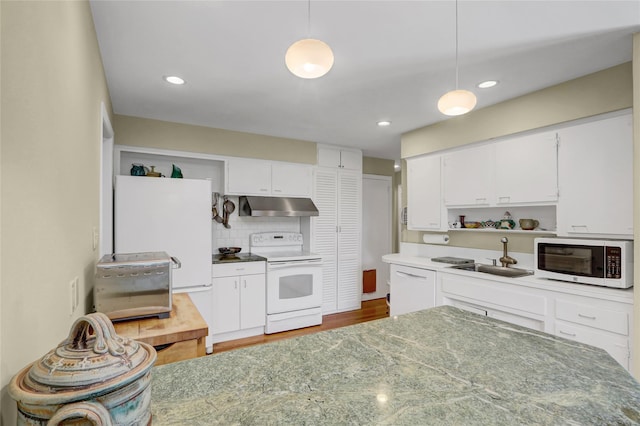 1 Exeter Pl, Glen Head, NY 11545 - kitchen with white appliances, under cabinet range hood, a sink, open shelves, and white cabinets