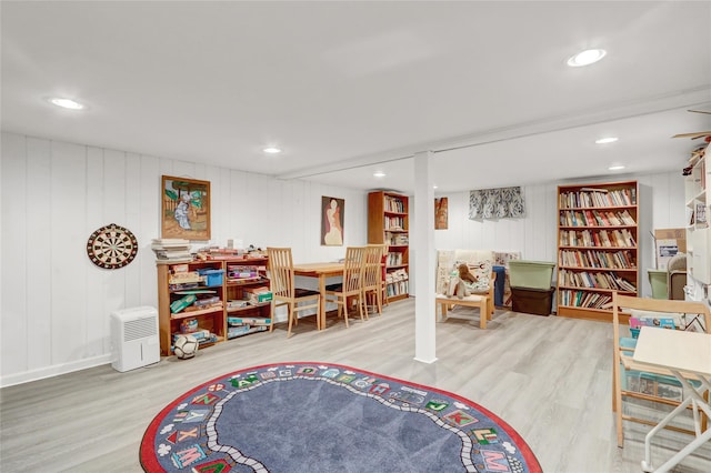 1 Exeter Pl, Glen Head, NY 11545 - rec room featuring wood finished floors, a decorative wall, and recessed lighting